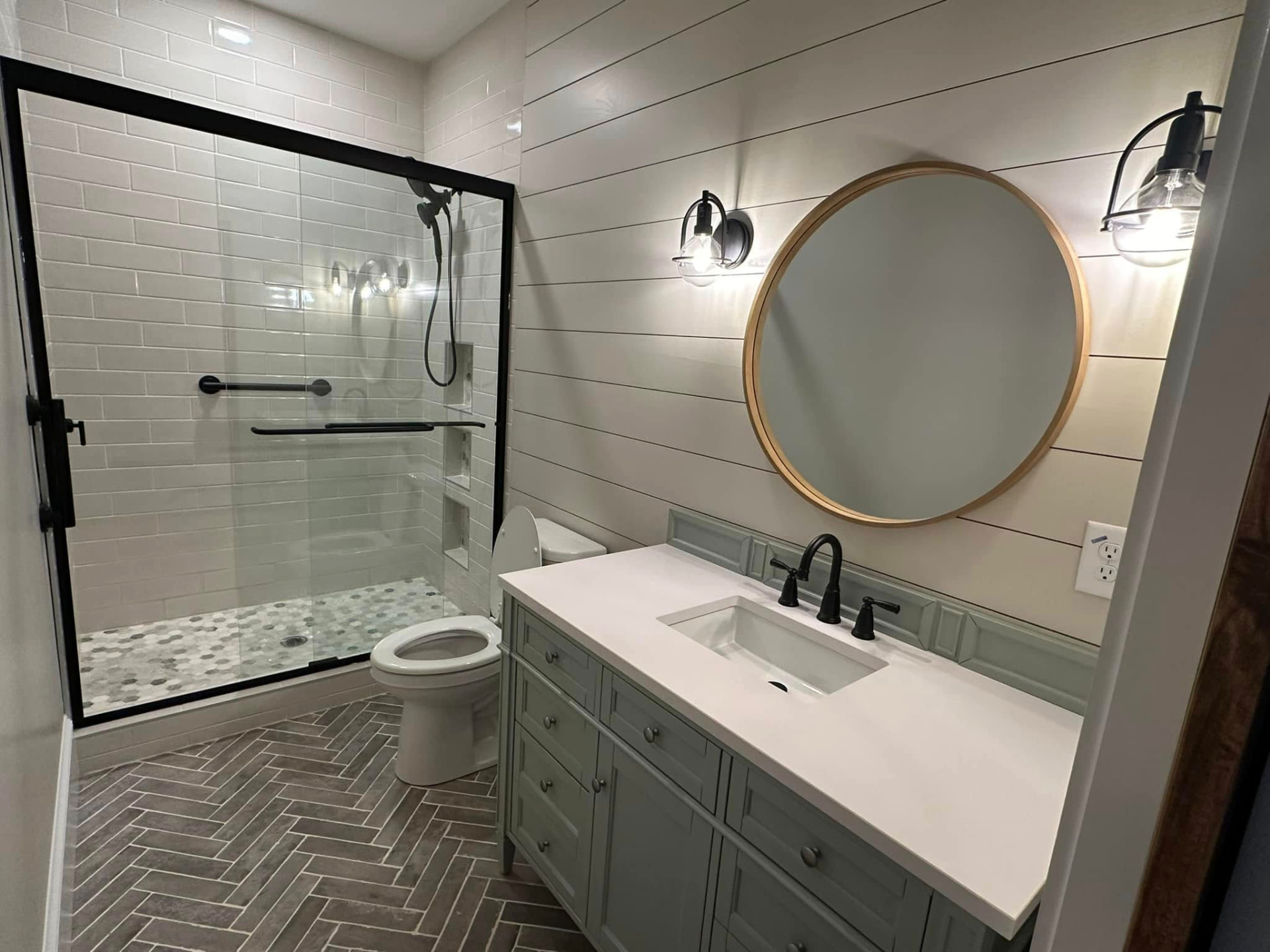 Guest bath with shiplap and herringbone tile