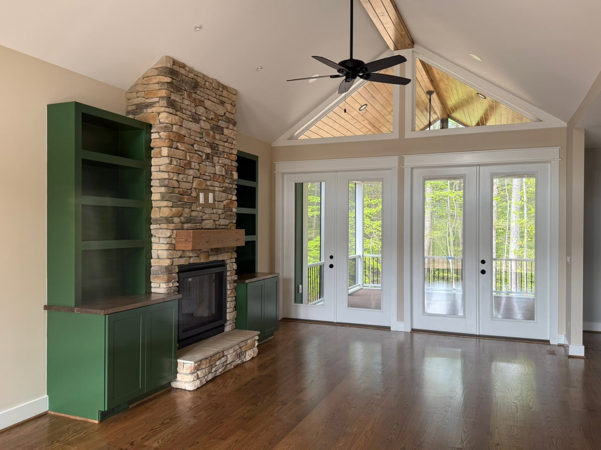 Vaulted great room with stone fireplace