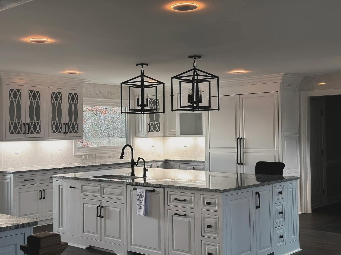 White custom kitchen with lantern pendants